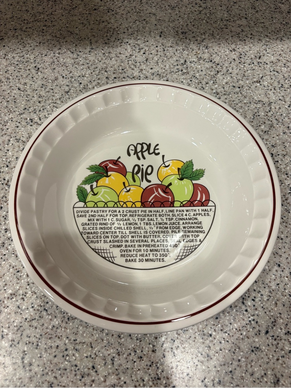 Vintage ceramic pie dish featuring a printed apple pie recipe
